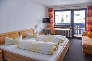 Postel nebo postele na pokoji v ubytování Hotel garni Siebenstern