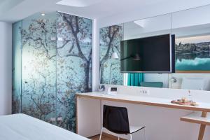 TV a/nebo společenská místnost v ubytování Olive Green Hotel
