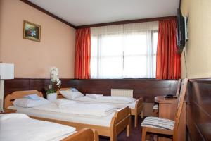 Кровать или кровати в номере Hotel TISA