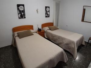 Postel nebo postele na pokoji v ubytování Pensíon Lucia