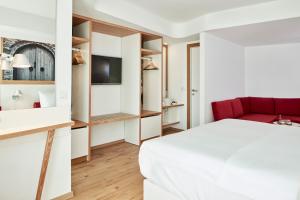 Postel nebo postele na pokoji v ubytování Olive Green Hotel