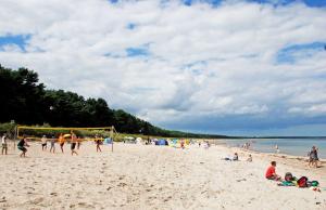 a group of people playing soccer on a beach at Haus Friedenswinkel in Thiessow