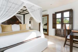 Cama ou camas em um quarto em Agroturismo Atzaró