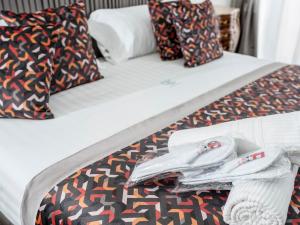 Postel nebo postele na pokoji v ubytování Palazzo Firenze