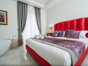 Postel nebo postele na pokoji v ubytování Palazzo Firenze
