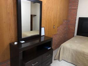 Postel nebo postele na pokoji v ubytování Hotel María Elena
