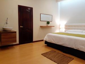 Postel nebo postele na pokoji v ubytování Casa D´Cristhi