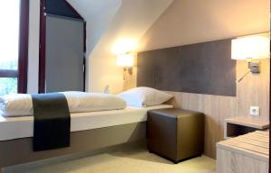 Postel nebo postele na pokoji v ubytování Hana Aparthotel