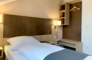 Postel nebo postele na pokoji v ubytování Hana Aparthotel