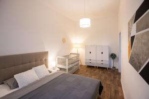 Postel nebo postele na pokoji v ubytování FAMILY Apartment OSTRAVA