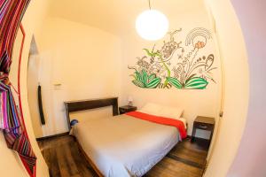 Giường trong phòng chung tại Dragonfly Hostels Cusco