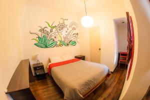 Giường trong phòng chung tại Dragonfly Hostels Cusco