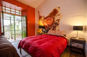 Llit o llits en una habitació de Dragonfly Hostels Cusco