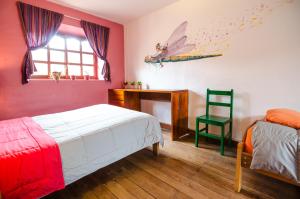 Giường trong phòng chung tại Dragonfly Hostels Cusco
