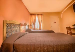 Postel nebo postele na pokoji v ubytování Hotel del Rio