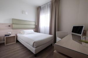 
Letto o letti in una camera di Hotel La Torretta
