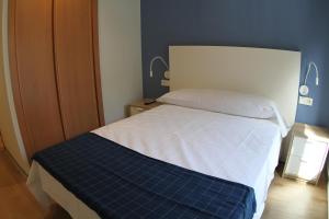Postel nebo postele na pokoji v ubytování Hostal Mónaco