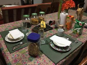 a table with plates and jars of food on it at TSEliot Bed&Breakfast in Banfield +9 photos