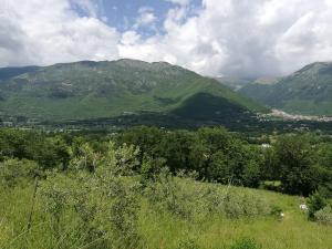 a view of a valley with mountains in the background at Tenuta Castelli in San Donato Val di Comino