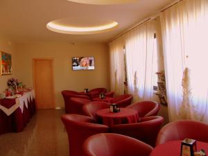 TV a/nebo společenská místnost v ubytování Hotel Genius