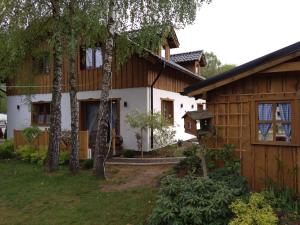 a house with a giraffe in front of it at Apartament 4 osobowy in Kujan
