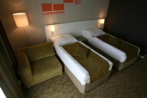 Posteľ alebo postele v izbe v ubytovaní Hotel EMPIRE