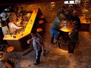 a group of people sitting at tables in a restaurant at Landgasthof Cafe Gut Ahe in Kirchhundem