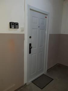 a white door in a room with a wall at Apartment Bratislava center in Bratislava