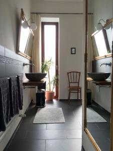 a bathroom with a sink and a mirror at Privatzimmer Leopold in Sigmaringen