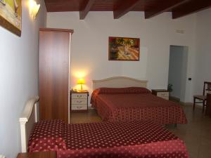 Ένα ή περισσότερα κρεβάτια σε δωμάτιο στο Hotel Genius