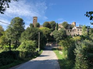 a road with a castle in the distance at Sun Garda in Ponti Sul Mincio