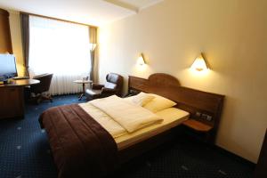 Postel nebo postele na pokoji v ubytování Eden-Hotel