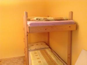 A bed or beds in a room at Chalupa Kucbel