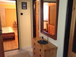 A bed or beds in a room at Chalupa Kucbel