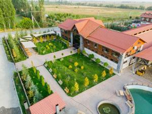an aerial view of a building with a large garden at MURAS Resort 2025 in Bishkek
