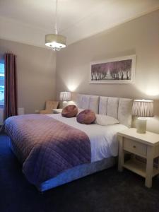 a bedroom with a large bed with two pillows on it at Bolands Self Catering Accommodation in Hacketstown