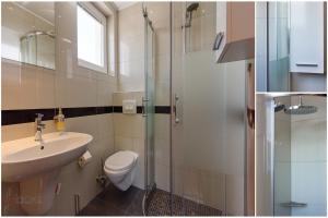 a bathroom with a toilet and a sink and a shower at House Moderna 2 in Crikvenica +32 photos