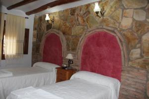 Postel nebo postele na pokoji v ubytování Casa Rural Laura