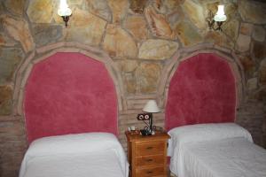Postel nebo postele na pokoji v ubytování Casa Rural Laura