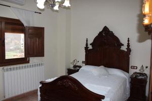 Postel nebo postele na pokoji v ubytování Casa Rural Laura