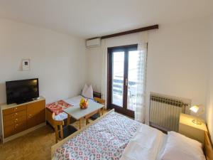 Posteľ alebo postele v izbe v ubytovaní Apartments DESA