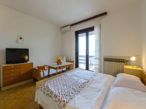 Posteľ alebo postele v izbe v ubytovaní Apartments DESA
