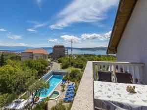 a balcony with a view of a swimming pool at Villa Summertime in Crikvenica