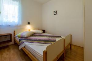 Ein Bett oder Betten in einem Zimmer der Unterkunft Apartments Alin