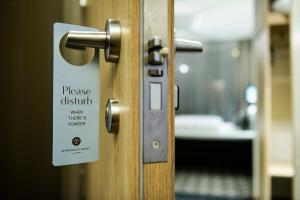 a sign on a door that reads please disturb was there as promised at Myrkdalen Resort Hotel in Myrkdalen