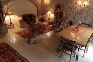 a living room with a table and a couch at Maison d'Ines centre historique garage privé in Blois +41 photos