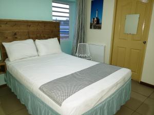 Cama ou camas em um quarto em Mustique Suites Curacao