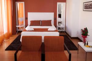 מיטה או מיטות בחדר ב-Hotel Miramar Sul