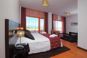 מיטה או מיטות בחדר ב-Hotel Miramar Sul
