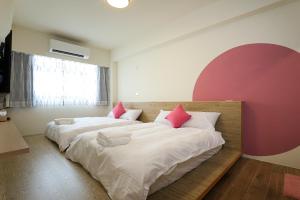 Postel nebo postele na pokoji v ubytování Colorful Balloons Homestay